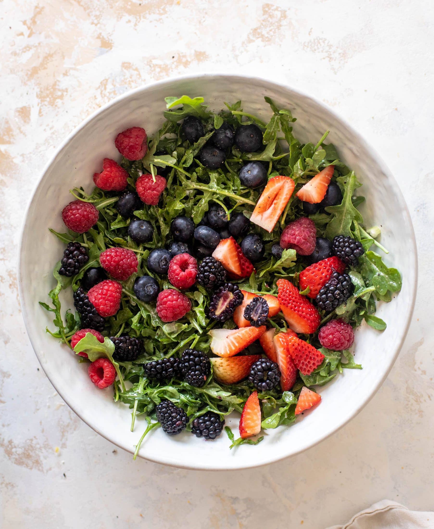 red white and berry arugula salad